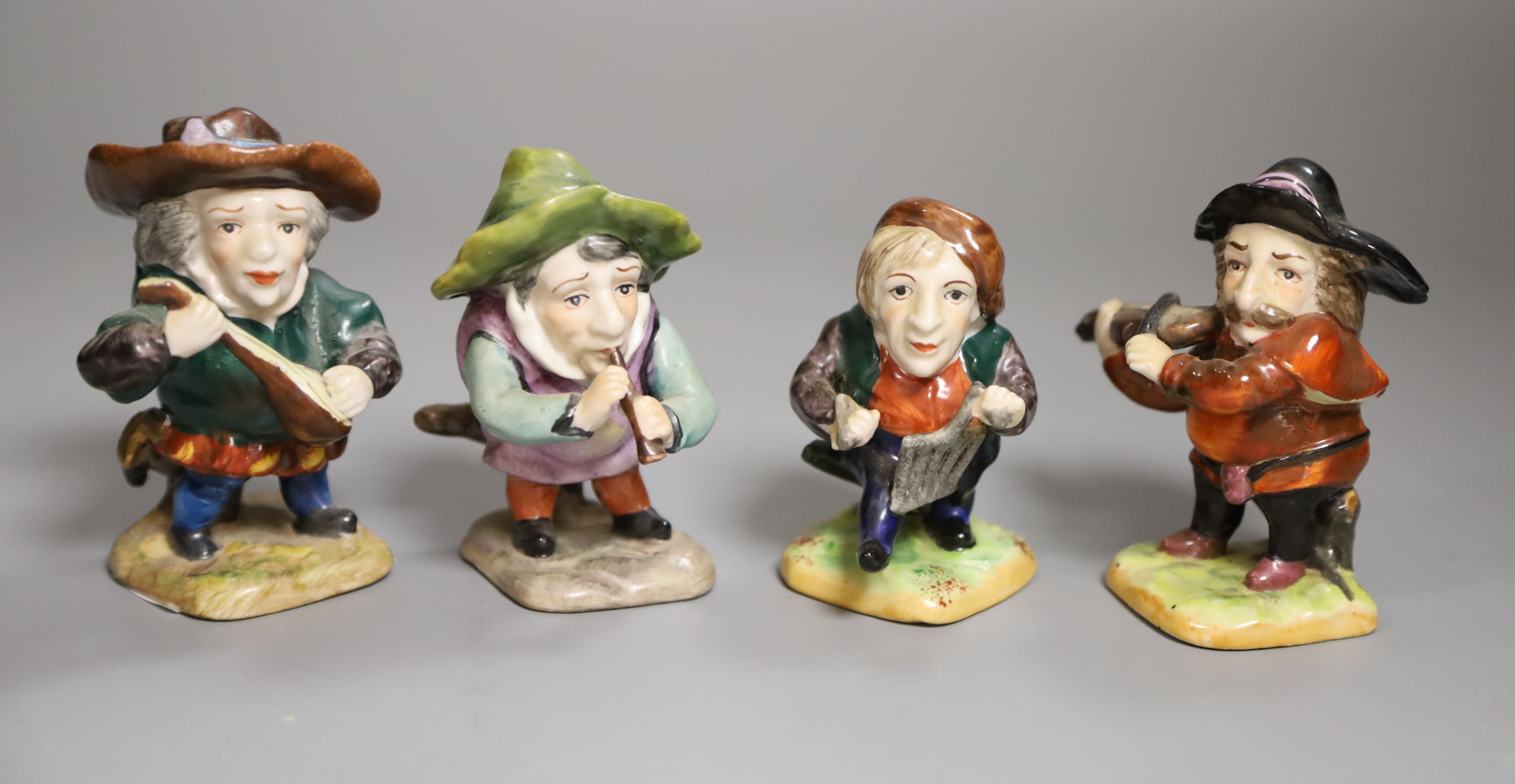 Four Continental porcelain musicians, height 10cm